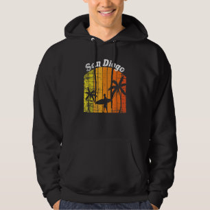 Vintage Surfing Human goes past Palm Trees with a Hoodie