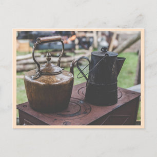 Vintage tea kettles on old stove postcard