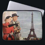 Vintage Tourists at Eiffel Tower, Paris Vacation Laptop Sleeve<br><div class="desc">Vintage illustration travel and transportation image featuring vacationing newlyweds sightseeing in Paris, France with the Eiffel Tower in the background. A love and romance design with a man and woman on a romantic vacation, a couple in the city of lights on their honeymoon. She is holding a map of the...</div>