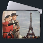 Vintage Tourists Travelling in Paris Eiffel Tower Laptop Sleeve<br><div class="desc">Vintage illustration travel and transportation image featuring vacationing newlyweds sightseeing in Paris, France with the Eiffel Tower in the background. A love and romance design with a man and woman on a romantic vacation, a couple in the city of lights on their honeymoon. She is holding a map of the...</div>