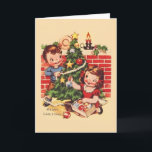 Vintage Tree Decorating Christmas Card<br><div class="desc">Retro / Vintage Christmas greeting card.  Two adorable children decorating their Christmas Tree!  Merry Christmas!</div>