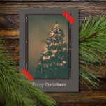 Vintage Upcycle Instant Photo Typewriter Christmas Holiday Card<br><div class="desc">Capture the magic of the holiday season with our rustic Instant Photo Style Christmas Holiday Card. This charming design eloquently blends nostalgia with festive cheer, featuring a captivating Christmas tree photo that evokes the warmth of cherished traditions. Each card is adorned with typewriter style text, offering a timeless aesthetic that...</div>