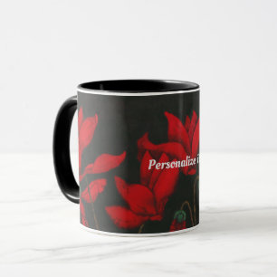 Vivid red Cyclamen on a dark black background Mug