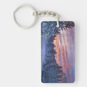 Vivid sunset paints the sky above wintery key ring