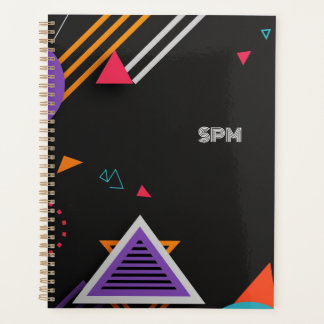 Vividly-coloured shapes on a dark background planner