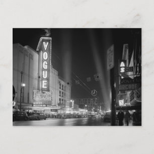 Vogue Theatre at night with spotlights Postcard