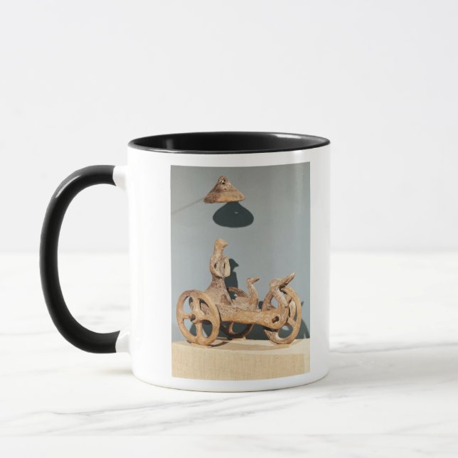 Votive chariot with an anthropomorphic divinity mug (Left)