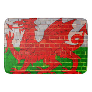 Wales flag on a brick wall bath mat