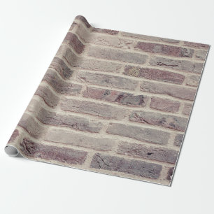 Wall built with bricks of various earth tones wrapping paper