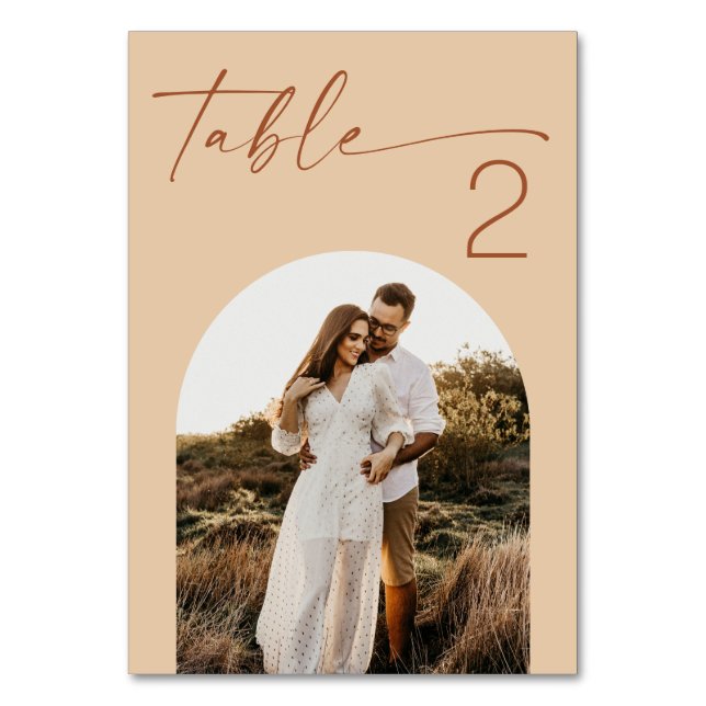 Warm Peach Sand Wedding | Modern Script Arch Photo Table Number (Front)