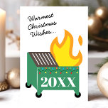 Warmest Christmas Wishes Dumpster Fire Holiday Card<br><div class="desc">Send a unique and humorous holiday greeting with this "Warmest Christmas Wishes" dumpster fire holiday card. Featuring a festive dumpster fire illustration adorned with Christmas lights and the year "20XX, " this card captures the chaotic spirit of the season with a touch of humor. Perfect for adding a lighthearted and...</div>
