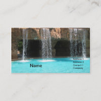 wate cascading by an outdoor cave and pool