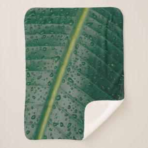 Water droplets on banana leaf sherpa blanket