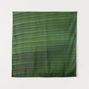 Water droplets on green leaf tapestry