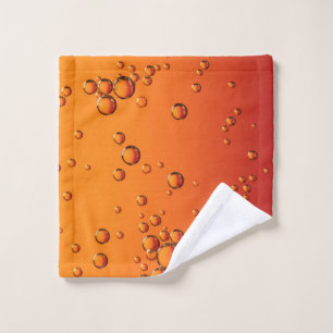 Water droplets on orange surface wash cloth