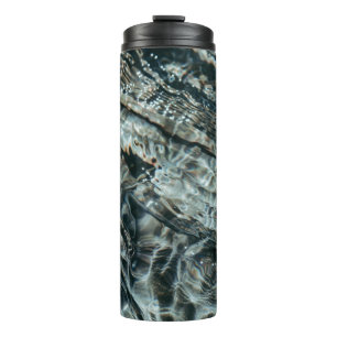 Water drops on body of water thermal tumbler