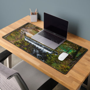 Water flowing through autumn forest desk mat