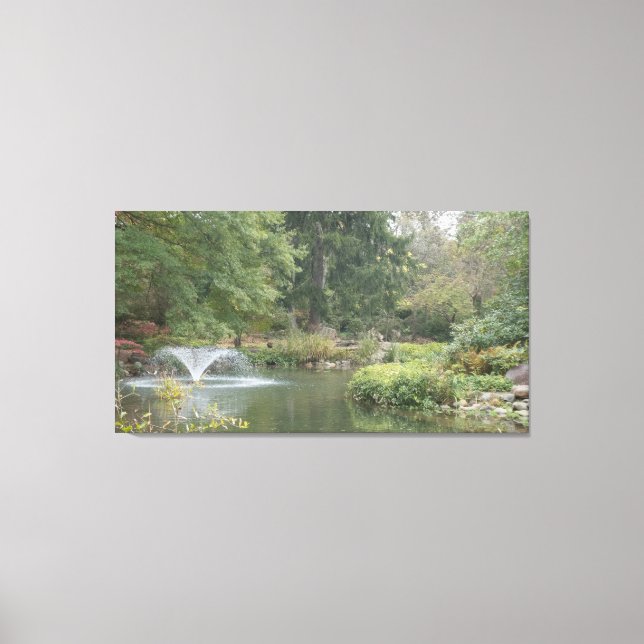 Water fountain in garden pond canvas print (Front)