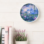 Water Lilies 1 Wall Clock<br><div class="desc">Water Lilies is a series of more than 200 oil paintings by French Impressionist Claude Monet (1840–1926). The paintings which are on display in museums around the world, depict Monet's flower garden at Giverny. During the last 30 years of his life, these paintings were Monet's main focus, many of which...</div>