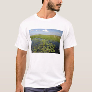 Water lilies and sawgrass in Florida everglades T-Shirt