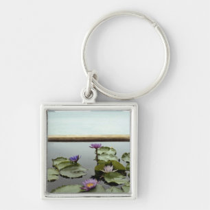 Water lilies in pond by ocean key ring