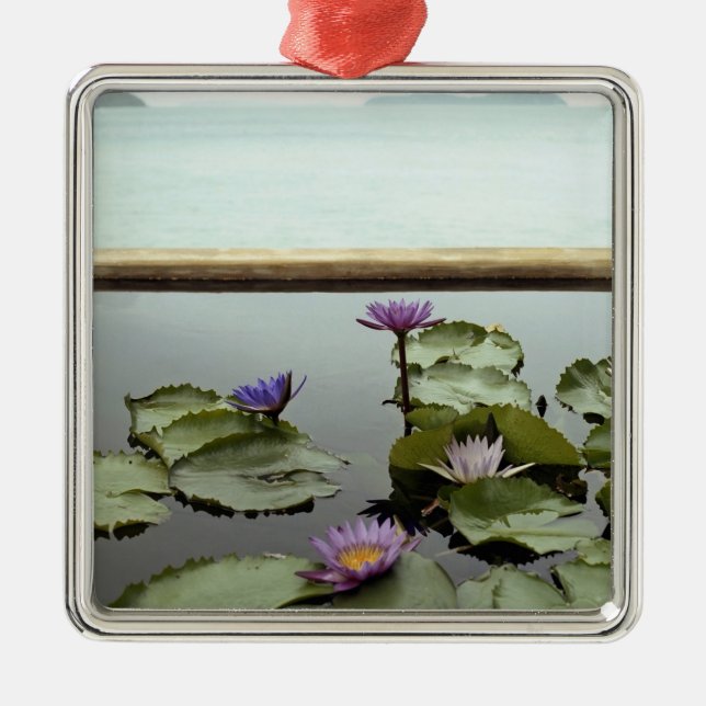 Water lilies in pond by ocean metal tree decoration (Front)