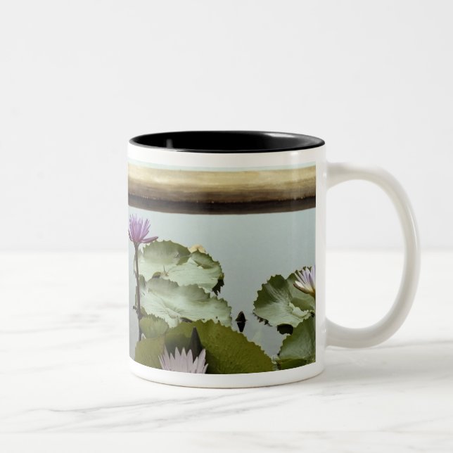 Water lilies in pond by ocean Two-Tone coffee mug (Right)