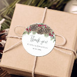Watercolor Botanical Christmas Wedding Thank You Classic Round Sticker<br><div class="desc">These elegant winter-themed wedding thank you stickers feature a rustic woodland winter evergreen bouquet with watercolor greenery sprigs and pine cones, accented with burgundy red holly berries. Find matching products in the collection, and feel free to message me through Zazzle Chat if you need design tweaks or more matching products....</div>