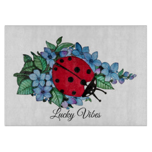 Watercolor Cute Ladybird With Blue Wild Flowers Cutting Board