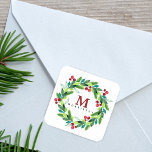 Watercolor Hallie and Berries Wreath Monogram Square Sticker<br><div class="desc">Sticker features watercolor berries and hollies wreath with monogram and last name.</div>