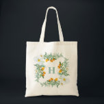 Watercolor Orchids and Kumquats Monogram Tote Bag<br><div class="desc">The perfect tropical tote bag this summer. It featuring watercolor floral frame of white orchids,  kumquats and greenery. Personalise by adding your own monogram. This orchid monogram tote bag will be perfect as a personalised gift.</div>