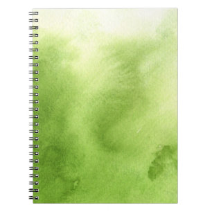 watercolor paints on a rough texture paper notebook