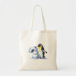 Watercolor Penguin building a snowmen Tote Bag