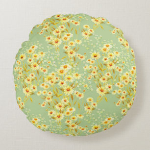 Watercolor picture of daisy flowers on a light gre round cushion
