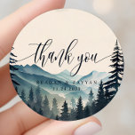 Watercolor Pine Tree Mountain Wedding Thank You Classic Round Sticker<br><div class="desc">Express your gratitude with a touch of rustic elegance using the Watercolor Pine Tree Mountain Wedding Thank You Classic Round Sticker. This sticker, printed on durable material, depicts a tranquil watercolor scene of pine trees and mountains. A heartfelt 'Thank You' message, written in modern typography, graces the centre of the...</div>