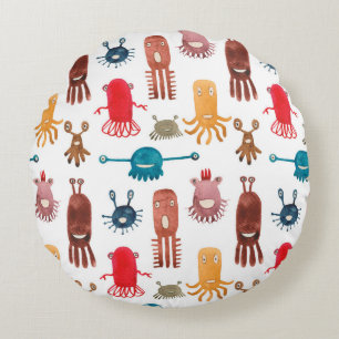 Watercolor seamless pattern of funny monsters and round cushion