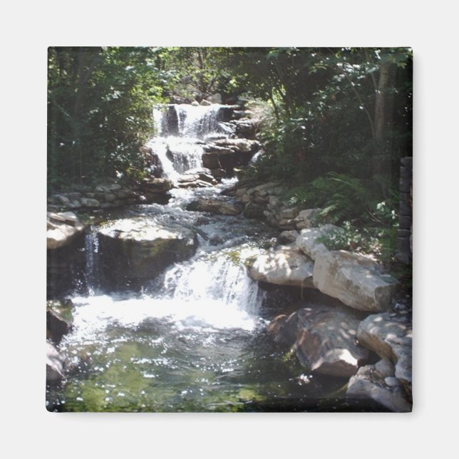 Waterfall streams over rocks into calm pool magnet (Front)