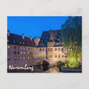 Waterfront building at night in Nuremberg, Germany Postcard