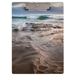 Wave breaking on beach, California Clipboard