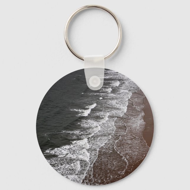 Waves breaking on a sandy beach key ring (Front)