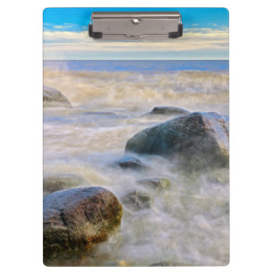 Waves crashing on shoreline rocks clipboard