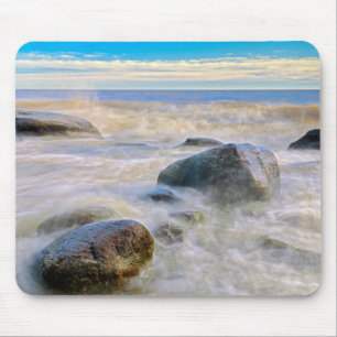 Waves crashing on shoreline rocks mouse mat