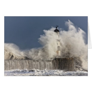 Waves Crashing Up Against A Lighthouse