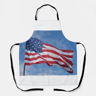 Waving American Flag Against Blue Sky Apron