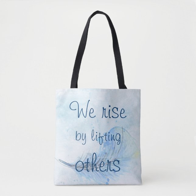We rise by lifting others watercolor feather tote bag (Front)