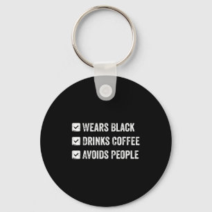 Wears black drinks coffee avoids people key ring