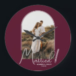 Wedding Arch Photo Burgundy Large Clock<br><div class="desc">A special keepsake features your wedding photo in an elegant arch design with the text "Married" in chic lettering along with your names and wedding date on a burgundy background small or large wall clock. Beautiful gift for your family and a fabulous memory to display in your own home. BACKGROUND...</div>