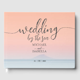 Wedding by the sea under peachy sky sunset guest book