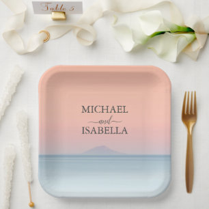 Wedding by the sea under peachy sky sunset paper plate