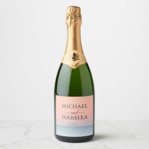 Wedding by the sea under peachy sky sunset sparkling wine label